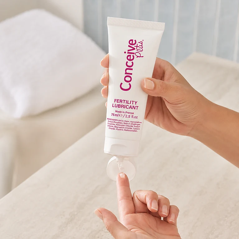 Conceive Plus fertility lubricant being dispensed onto a fingertip