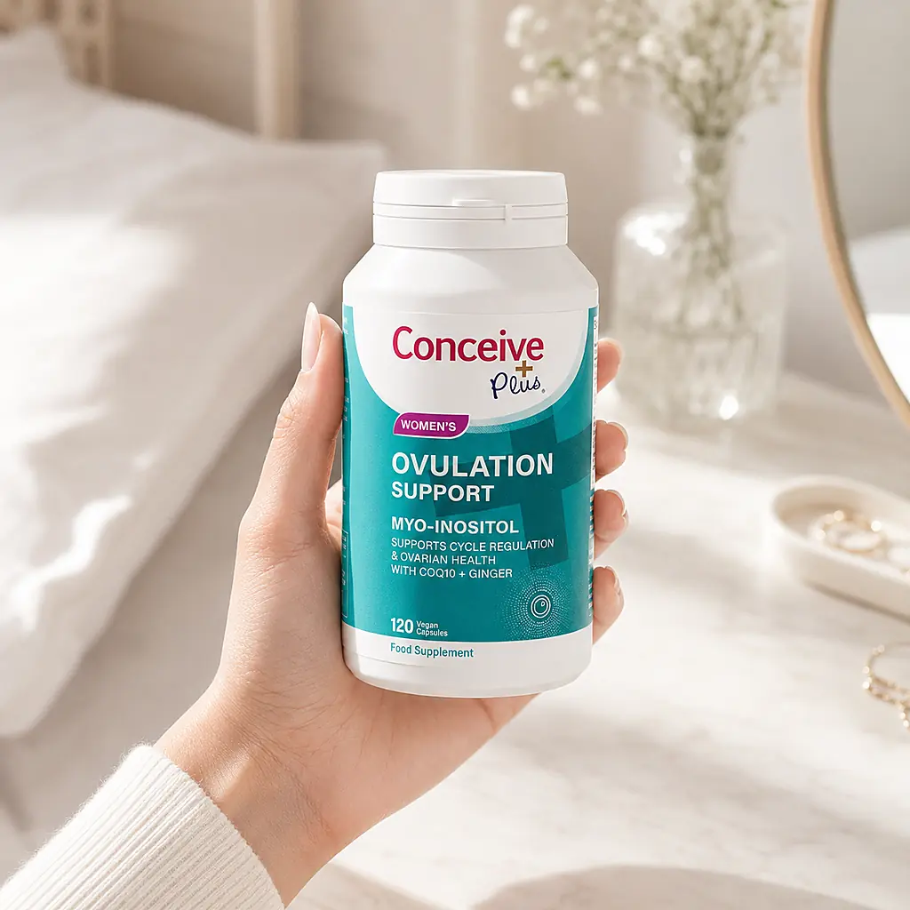 Woman holding Conceive Plus Ovulation Support in Australia
